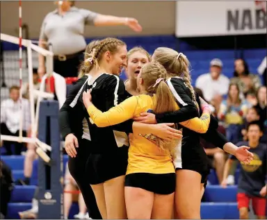  ?? Photo courtesy of JBU Sports Informatio­n ?? John Brown volleyball players celebrate after scoring a point against Oklahoma City University at Bill George Arena on Oct. 7. JBU won road games last week at Central Christian and Langston.