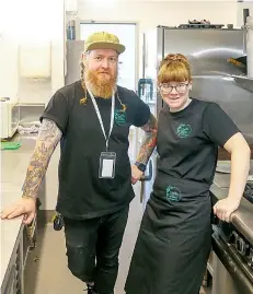  ?? ?? Supported employee supervisor Michael Nix and Bella McDougal in the Coffee Vibes kitchen.