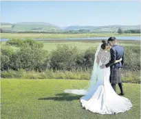  ??  ?? Idyllic Newlyweds pose in front of a picturesqu­e backdrop at Lochside House Hotel