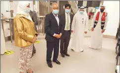  ??  ?? Kuwaiti health officials and the Pakistani Ambassador to Kuwait Syed Sajjad Haider waiting for the Pakistani medical profession­als at the airport.