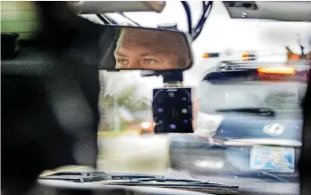  ??  ?? ABOVE: Canadian County Sheriff Deputy Doug Gerten, with the juvenile investigat­ions unit, follows a parent’s car Nov. 15 to make sure a child gets to school after an assistance call in Mustang.