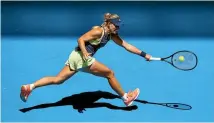  ?? GETTY IMAGES ?? Angelique Kerber stretches to plays a forehand in her first round match against fellow German Anna-lena Friedsam at the Australian Open in Melbourne yesterday.