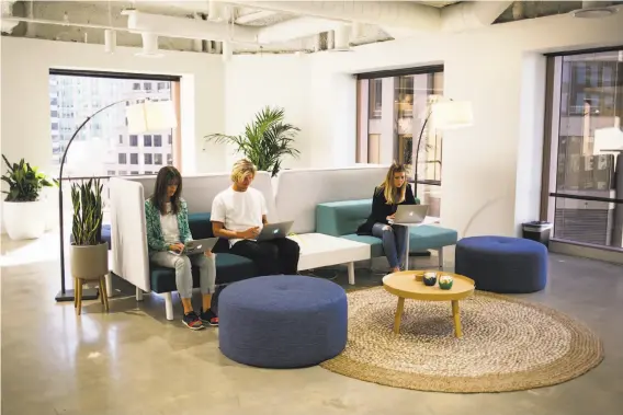  ?? Mason Trinca / Special to The Chronicle ?? Stitch Fix employees work in the common areas of their office in S.F. The personal shopping startup sends customers a box of five items to choose from.