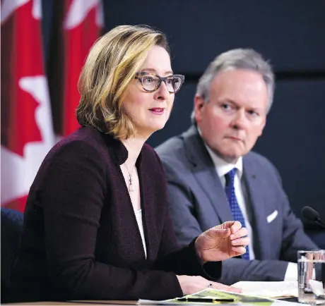  ?? JUSTIN TANG/THE CANADIAN PRESS ?? Bank of Canada governor Stephen Poloz and senior deputy governor Carolyn Wilkins announce the economic outlook in April. Most observers expect the central bank to lift interest rates to 1.5 per cent on July 11, which would be the first increase since...