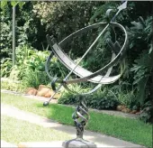  ??  ?? Use sculptures and ornaments like this sundial to decorate your garden instead of water features.