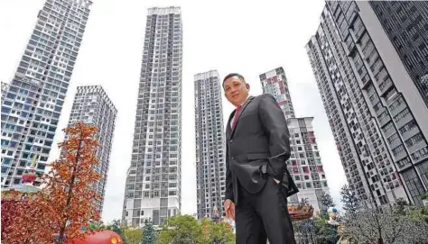  ??  ?? I-Berhad group executive chairman Tan Sri Lim Kim Hong standing proudly among the tall structures he built in i-City.