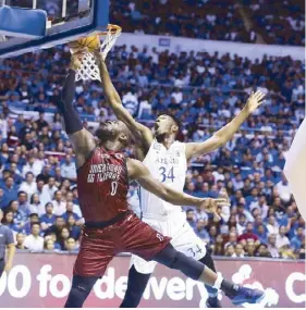  ??  ?? UP’s Paul Desiderio puts up a valiant effort against Thirdy Ravena and Kakou Kouame of Ateneo (top). Bright Akhuetie of UP and Kakou Kouame of Ateneo make for an exciting match up (above). Akhuetie is named MVP (right).