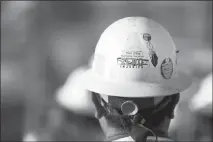 ?? STEVE MARCUS ?? A “Zero Injuries” logo is shown on a worker’s hardhat at the Las Vegas Raiders stadium constructi­on site.