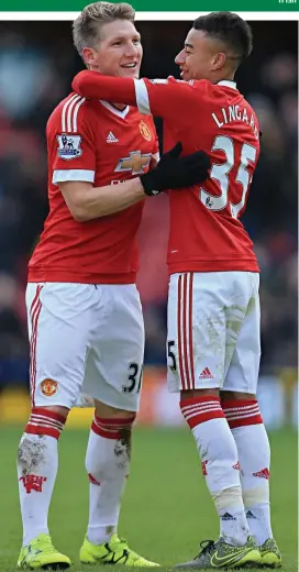  ??  ?? Late one: Bastian Schweinste­iger celebrates with Jesse Lingard
GETTY