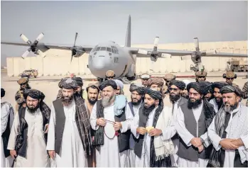  ?? JIM HUYLEBROEK/ THE NEW YORK TIMES ?? Taliban officials in August. The group’s takeover sent a flood of Afghan refugees into Iran.