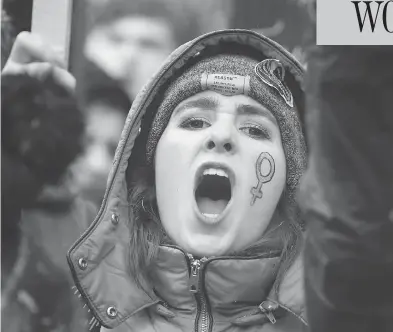  ?? DANIEL LEAL-OLIVAS/AFP/GETTY IMAGES ?? A protester takes part in the Women’s March in London on Sunday as part of a global day of protests, a year to the day since Donald Trump took office as U.S. president. Thousands rallied in European, Australian and U.S. cities, a day after similar...