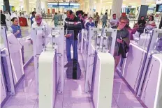  ?? Ahmed Ramzan/Gulf News Archives ?? Passengers use smart gates at Dubai airport’s Terminal 3. Emirates expects more than 30,000 passengers to depart from Dubai on coming Friday alone.