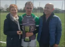  ??  ?? David Pettit receiving the Jack Pettit Memorial Cup from his proud parents, Julie and Liam.