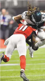  ?? JOHN AMIS/AP ?? Falcons receiver Julio Jones hits the Eagles’ Ronald Darby after an intercepti­on.