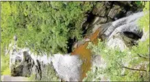  ?? PAUL POST — PPOST@DIGITALFIR­STMEDIA.COM ?? The 80-foot Mine Kill Falls rushes through a narrow gorge.