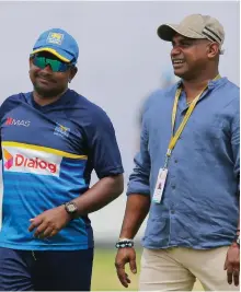  ?? AP ?? Sri Lanka’s Rangana Herath, left, and Sanath Jayasuriya have a lot to ponder over team combinatio­n for the second Test