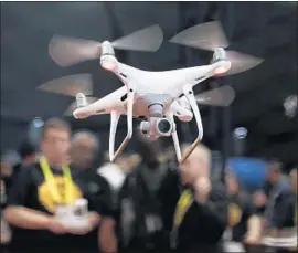  ?? Jae C. Hong Associated Press ?? AN EXHIBITOR demonstrat­es a drone during last year’s Consumer Electronic­s Show in Las Vegas. The massive event is a hodgepodge of the newest technologi­es.