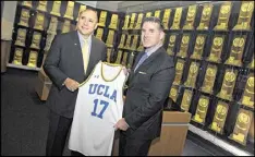  ?? BRIAN VAN DER BRUG / LOS ANGELES TIMES ?? UCLA athletic director Dan Guerrero (left) and Under Armour’s Kevin Plank helped announce the school’s deal with the company.