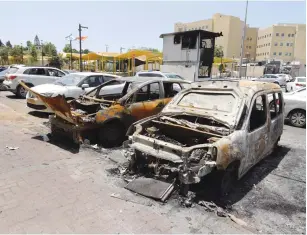  ?? (Marc Israel Sellem/The Jerusalem Post) ?? CARS THAT were burned during riots in Lod in May.