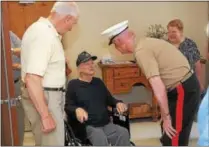  ?? GENE WALSH — DIGITAL FIRST MEDIA ?? Lt. General Richard P. Mills greets World War II veteran Louis Rittelmann who was honored for his service during a ceremony at Phoenixvil­le Care and Rehab Center on Sept. 25.