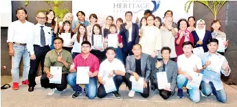  ??  ?? Winners of the Usaha Tegas Heritage Art Competitio­n last year with Usaha Tegas Sdn Bhd director Maureen Toh [standing, fifth right], Usaha Tegas Sdn Bhd chief operating officer Lim Ghee Keong [standing sixth right], and competitio­n judges Juhari Said [standing back row, far left], Hasanul Isyraf Idris, Parama Nathan, Chin Kon Yit and Dr Kim Phaik Lah and Laurence Loh.