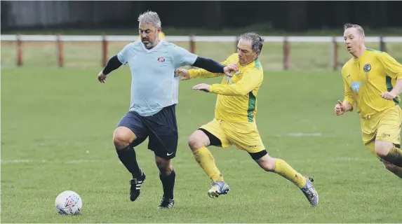  ??  ?? Sunderland and District Over 40s League Premier Division football between Ryhope Foresters (pale blue) and Wallsend Boys Club, which ended in a 3-3 draw. Photos by Tim Richardson.