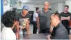  ?? WESTMINCOM­A ?? Indonesian Muhammad Farhan (back to the camera), the last kidnap victim being held by the Abu Sayyaf Group, undergoes medical check-up and debriefing after his rescue on Jan. 15.