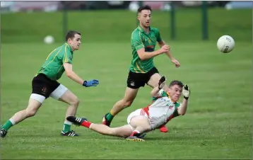  ??  ?? Kiltegan’s Colm keogh gets his pass away despite Hollywood pressure.