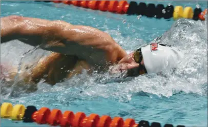  ?? BARRY TAGLIEBER - FOR MEDIANEWS GROUP ?? Above, Boyertown’s Nolan Benner swims in the 100-yard freestyle at the PAC Championsh­ips Saturday. Below, Phoenixvil­le’s Erini Pappas competes in the 100-yard butterfly event at Friday’s PAC swimming championsh­ips.