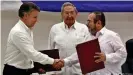  ??  ?? The Colombian government and FARC guerrillas signed a peace agreement at a 2016 ceremony in Havana