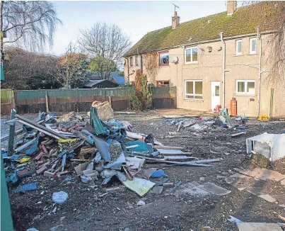  ?? Picture: Steven Brown. ?? Old fridges, scrap and waste piled up in the garden of the Kettlebrid­ge house.