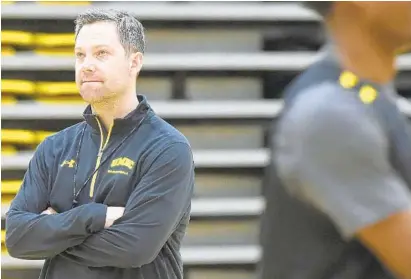  ?? KIM HAIRSTON/BALTIMORE SUN ?? In his second season as UMBC’s coach, Ryan Odom led the Retrievers to only their second NCAA Division I men’s basketball tournament appearance. The former point guard at Hampden-Sydney helped the team match the program record of 24 wins in a season.