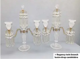  ??  ?? > Regency twin branch lustre drop candelabra