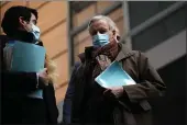  ?? FRANCISCO SECO — THE ASSOCIATED PRESS ?? EU chief Brexit negotiator Michel Barnier, right, leaves EU headquarte­rs in Brussels on Tuesday.