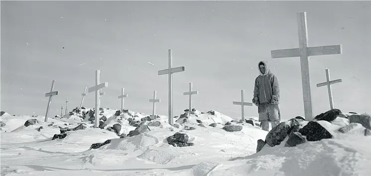  ?? PHOTOS COURTESY OF LIBRARY AND ARCHIVES CANADA AND THE CANADIAN HERITAGE PHOTOGRAPH­Y FOUNDATION ?? Above, Thomas Tapati in Settlement Cemetery, Baker Lake, in the former Northwest Territorie­s, now known as Baker Lake (Qamanittua­q), Nunavut. Top, from left: Loggers work on the Saint Anne River, Quebec; totem poles in Kispiox, British Columbia; and...