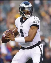  ?? RICH SCHULTZ - FOR THE ASSOCIATED PRESS ?? Eagles quarterbac­k Jalen Hurts looks to pass during the first half of a pre-season game against the Pittsburgh Steelers Thursday night at Lincoln Financial Field.