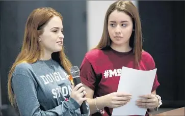  ?? Al Seib Los Angeles Times ?? HAYLEY LICATA, left, and Mia Freeman, students at Marjory Stoneman Douglas High School in Parkland, Fla., share their recent experience­s with students at Shalhevet High School in Los Angeles.