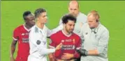  ?? REUTERS ?? Liverpool's Mohamed Salah walks off with tears in his eyes.