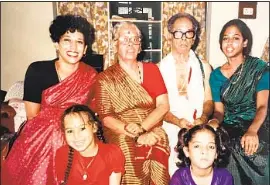  ??  ?? KAMALA HARRIS, back row left, with her Indian grandparen­ts in a family photo. Their mother raised Kamala and her sister Maya, right, as Black women.