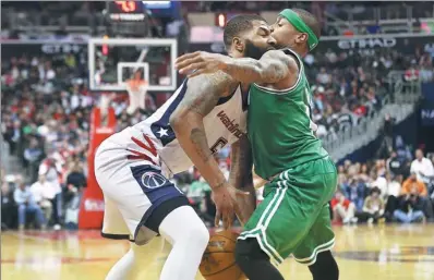  ?? USA TODAY SPORTS ?? Washington Wizards forward Markieff Morris has no place to go as Boston Celtics guard Isaiah Thomas stands his ground in the third quarter of Thursday’s Game 3 of their NBA Eastern Conference semifinal at Verizon Center in Washington, DC.
