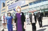  ?? Arnold Gold / Hearst Connecticu­t Media ?? Cynthia Sparer, center, senior vice president for operations and executive director of Women’s and Children’s Services at Yale New Haven Hospital, is photograph­ed outside of the Yale New Haven Hospital Emergency room with, from left, Dr. Elena Ratner, Patient Services Manager Camisha Taylor, Certified Nurse Mark Giles, and Mary Graham and Kevin Burgess of Environmen­tal Services on May 21.