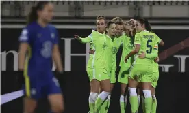  ?? League. Photograph: Swen Pf’rtner/AP ?? Wolfsburg celebrate Tabea Wassmuth’s double against Chelsea in the Women’s Champions