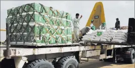  ?? Jon Gambrel ?? The Associated Press Workers unload aid carried into Yemen by the Saudi military Feb. 3 in Marib, Yemen. The civil war in Yemen, the Arab world’s poorest country, is entering its fourth year.