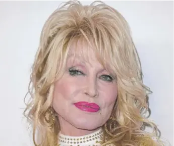  ?? VALERIE MACON/AFP VIA GETTY IMAGES ?? Music icon Dolly Parton is a lifelong philanthro­pist.