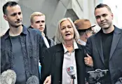  ??  ?? Justice at last: Sally Challen with her sons James, left, and David, after her release