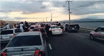  ?? CONTRIBUTE­D PHOTO ?? Traffic gridlock created by unruly motorists attending the New Year’s Day party made life difficult for Jamaicans and vistors alike desperate to reach the Norman Manley Internatio­nal Airport or to leave it.
