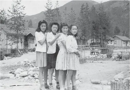  ??  ?? Friends of Michiko (Midge) Ayukawa pose at the Lemon Creek internment camp in the Slocan Valley.