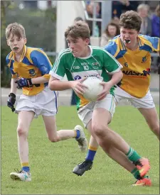  ??  ?? Joshua Doyle of Duffry Rovers races away from Taghmon-Camross duo Luke Murphy and Mark Doyle.