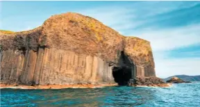  ??  ?? Fingal’s Cave, a sea cave on the isle of Staffa, was formed from hexagonall­y jointed basalt columns within a lava flow and is known for its acoustics.