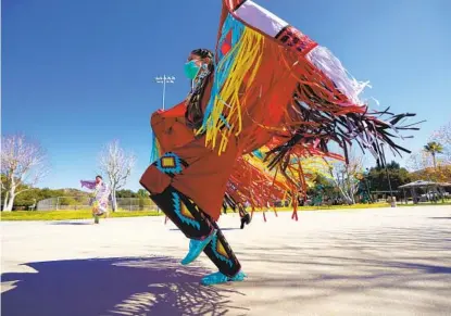  ?? NELVIN C. CEPEDA U-T ?? Ashley Jensen-hedegaard was among the dancers from the Fancy Moccasins Dance Organizati­on dancing at a park on the Pechanga Reservatio­n Feb. 27. Because of the pandemic, dancers have not had the opportunit­y to perform or compete at powwows.